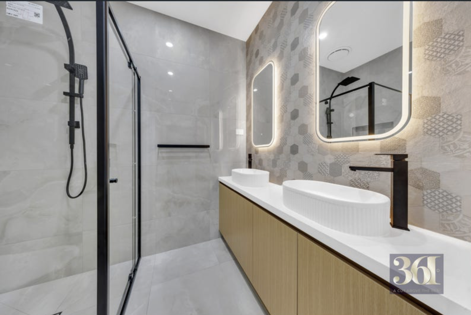 Bathroom vanity with illuminated mirrors